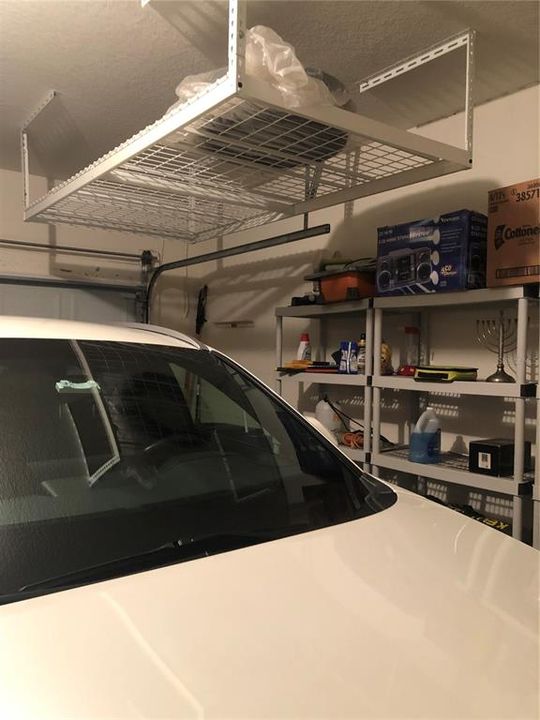2 car garage with storage shelves and overhead storage capabilities too!