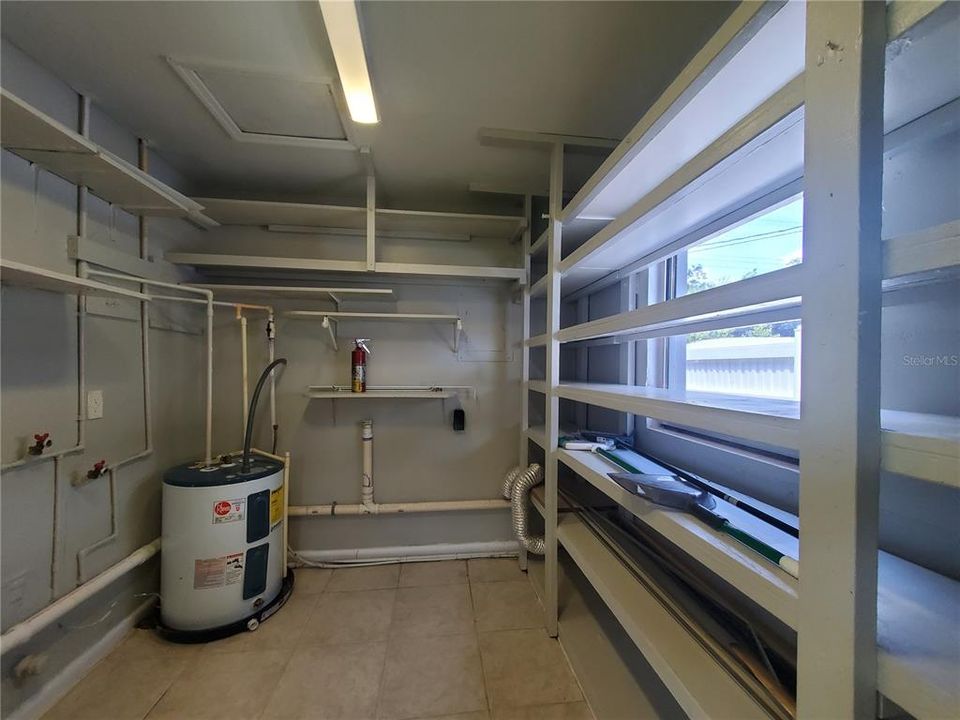 Spacious Laundry Room with shelving