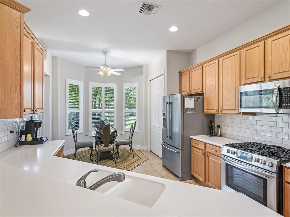 Kitchen with gas range and stainless appliances