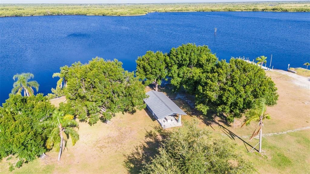 AERIAL VIEW OF PICNIC SHELTER AND LAKE.