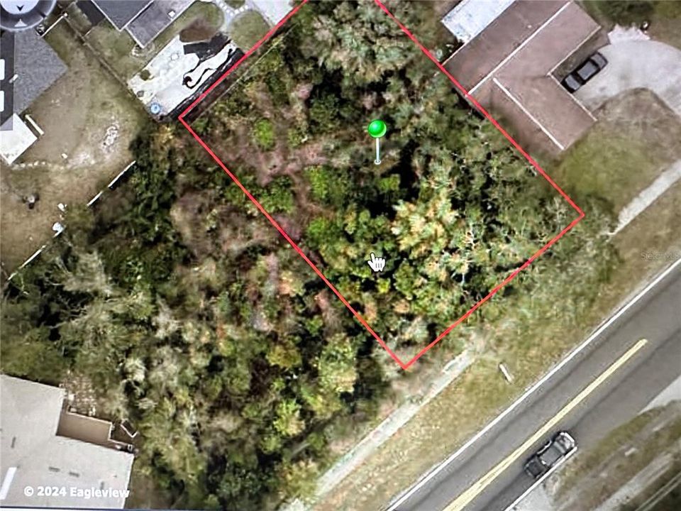 This property is outlined in red . The property to the left is also for sale and is 1718 Providence Blvd.