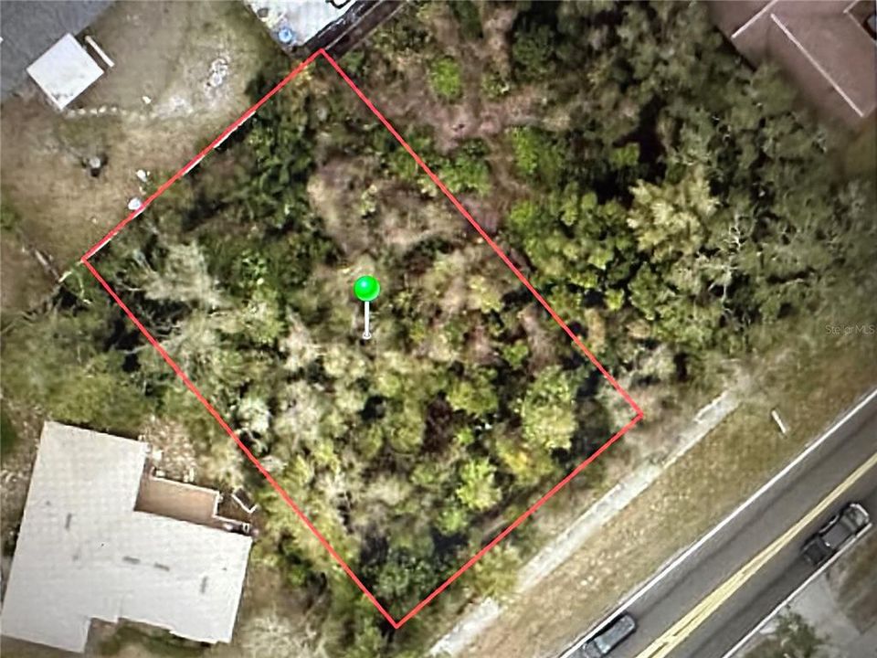 This property is outlined in red . The property to the right is also for sale, address to property on right is 1724 Providence Blvd.