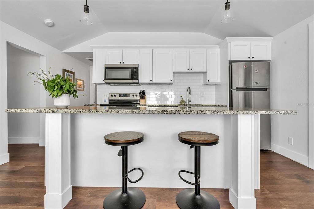Kitchen island offers a great place to gather.