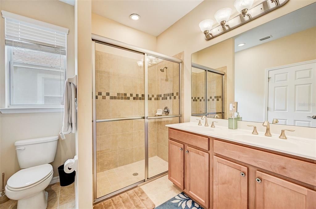 En-suite bathroom wiht Dual Sinks and Walk in Shower