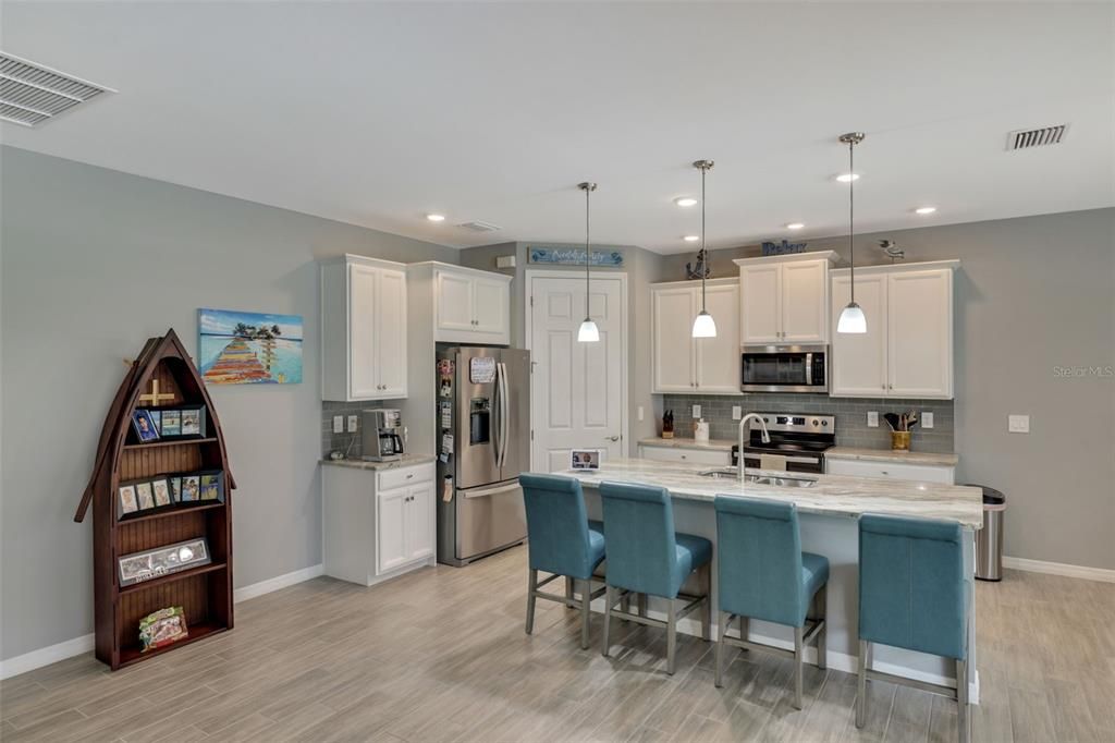 Kitchen with tall cabinets & coffe bar