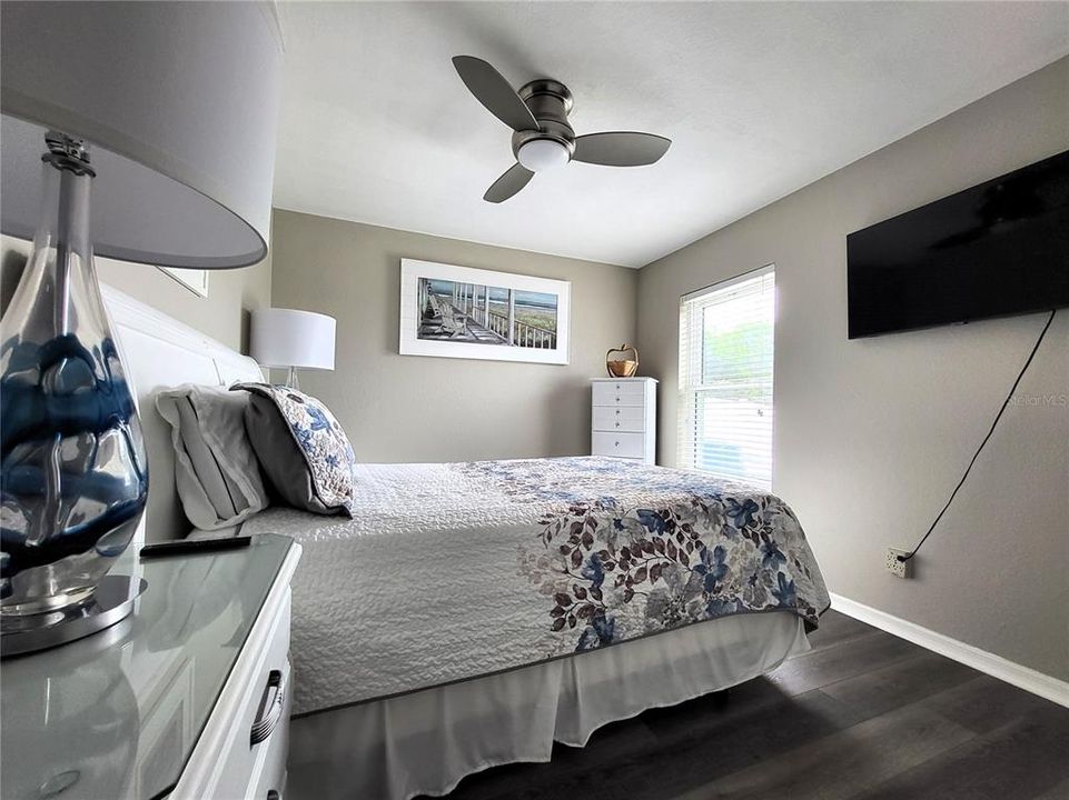 The rear guestroom has luxury vinyl flooring, and, like all the others, a remote-controlled fan/light.