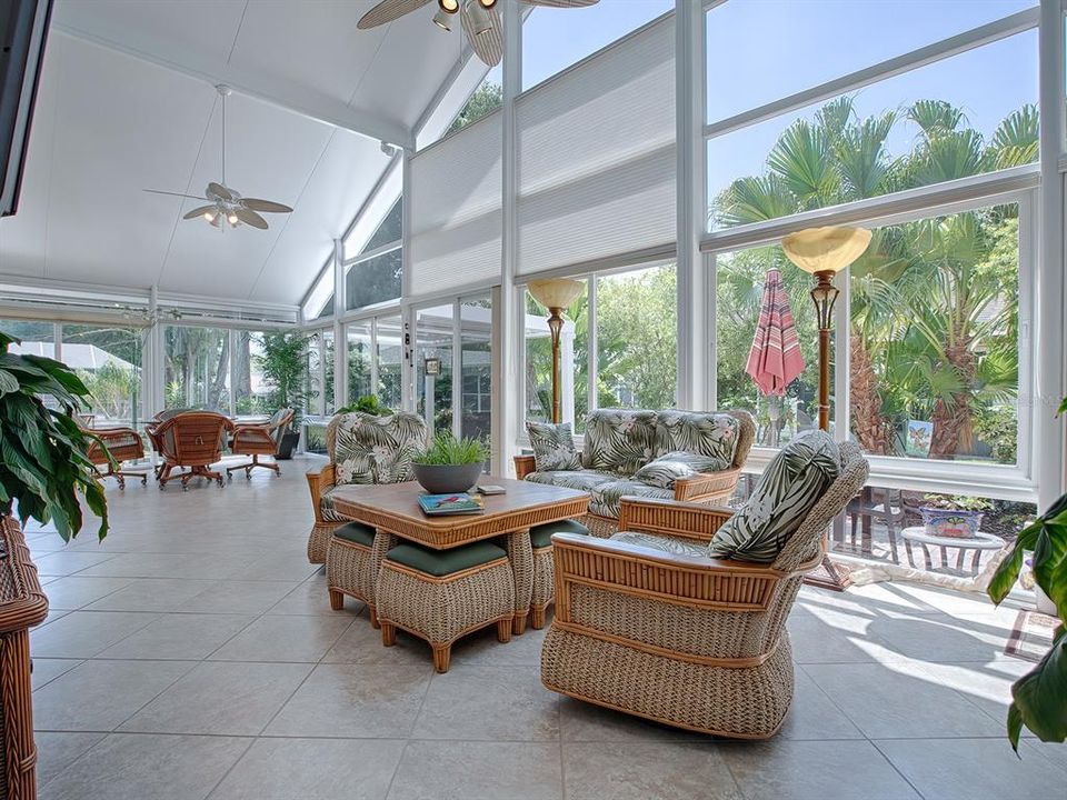 SPECTACULAR FLORIDA ROOM WITH DIAGONAL TILE, SUNSHADES AND CEILING FANS!