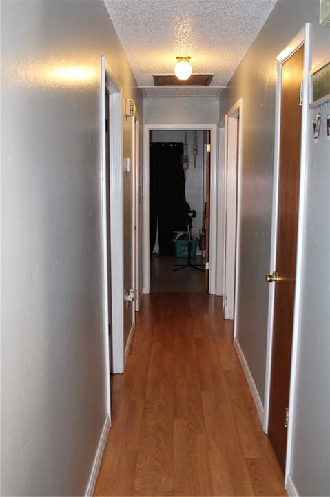 HALLWAY FROM LIVING AREA TO 4 BEDROOMS