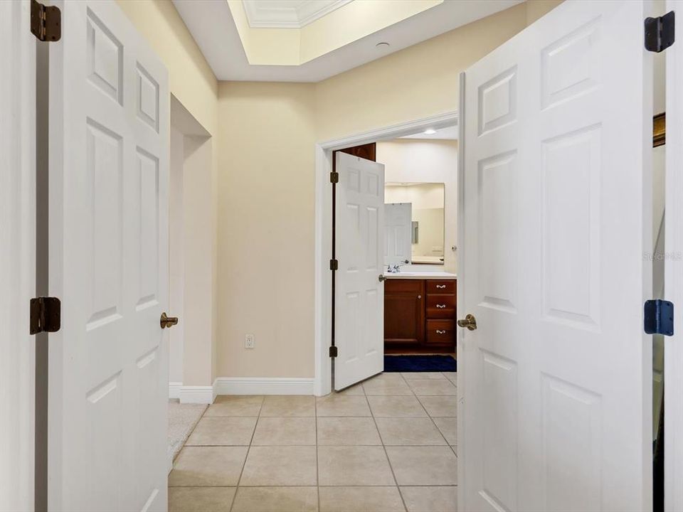 Double doors lead to primary suite