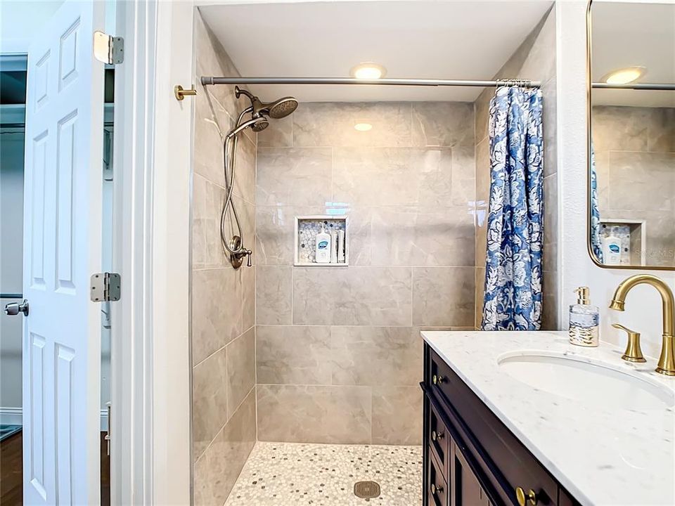 The Master/Ensuite bath is newly renovated with a tiled shower and Beautiful vanity.