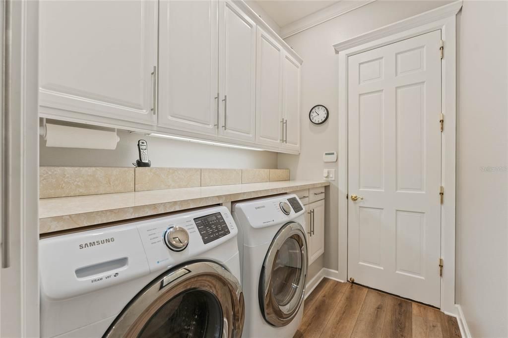 Indoor Laundry Room with Plenty of Storage Cabinets