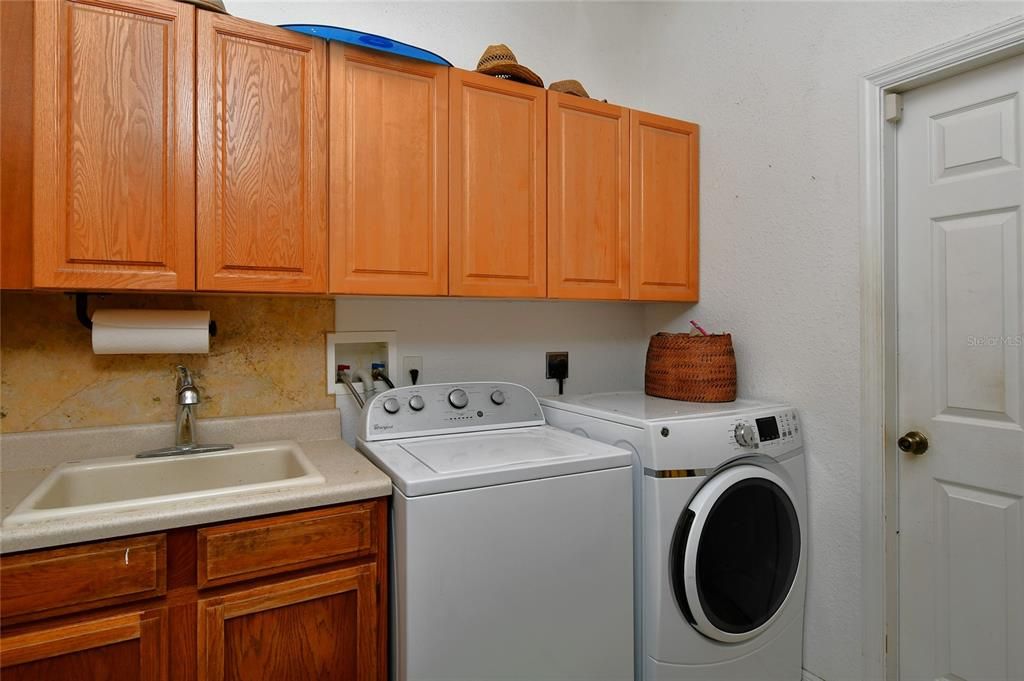 Laundry Room with deep sink and cabinetry