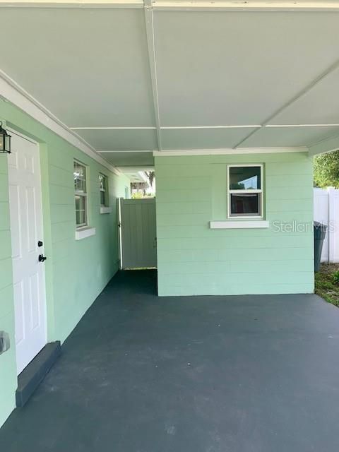 Carport, Laundry Room and gate to the Back Yard