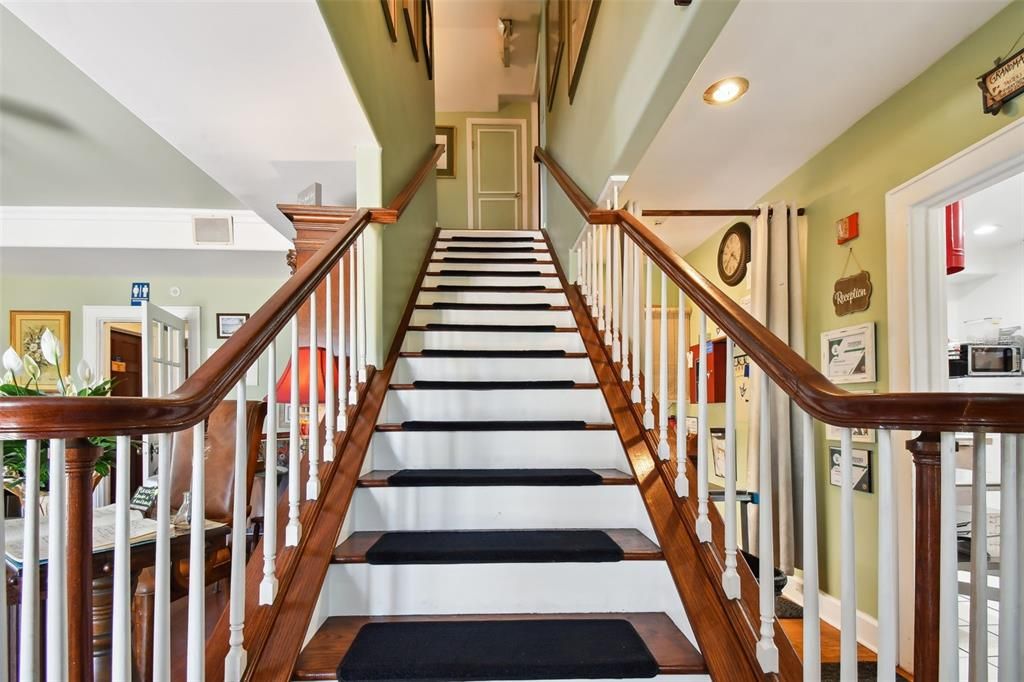 Grand Wooden Staircase to 2nd floor Suites