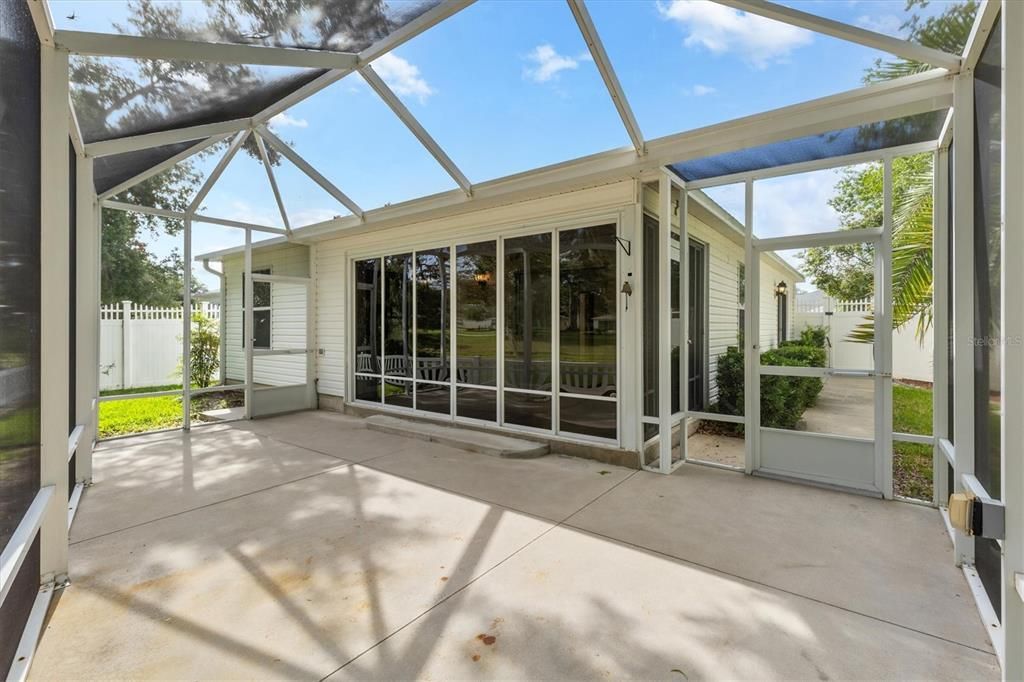 BIRDCAGE SHOWINIG DOOR TO SIDE YARD AND ENCLOSED LANAI