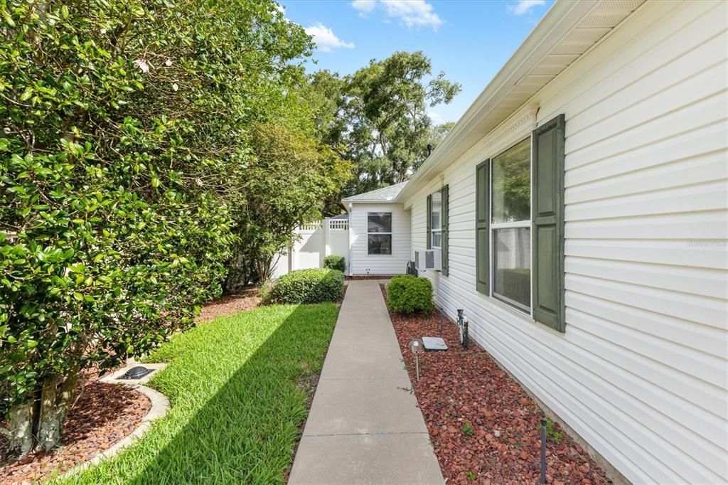 MAIN ENTRANCE AT SIDE OF HOME