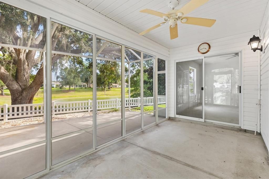 BIRDCAGE SHOWINIG DOOR TO SIDE YARD AND ENCLOSED LANAI