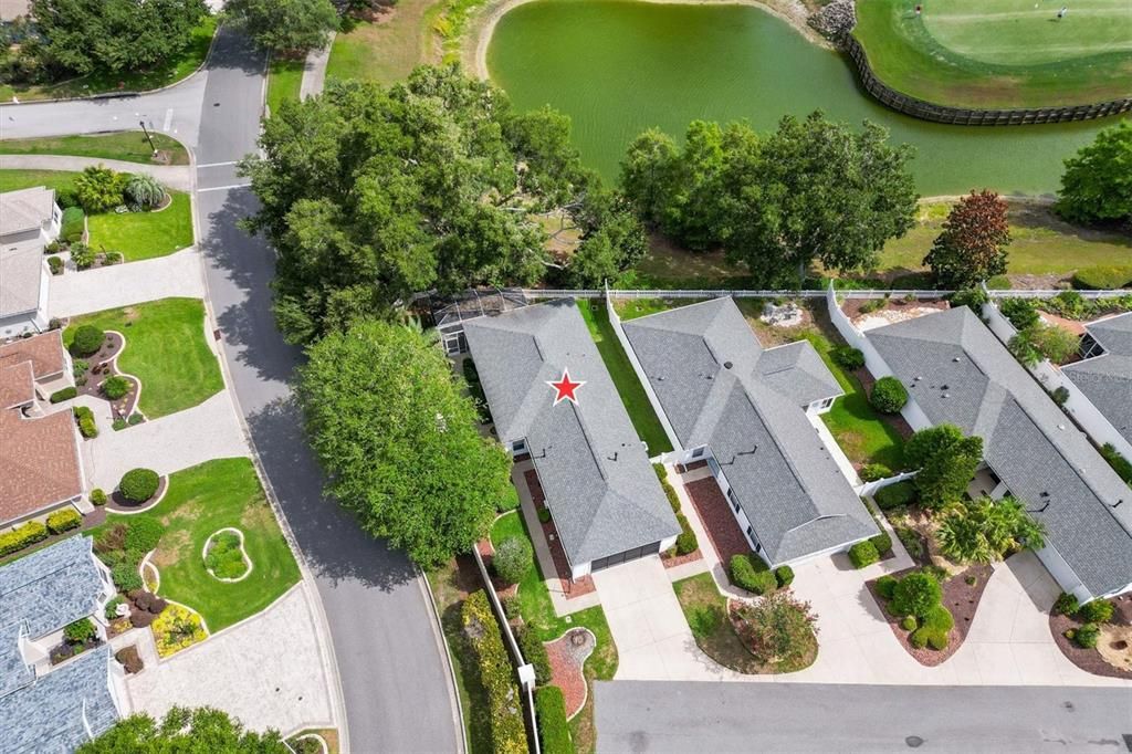 LEFT SIDE YARD WITH CONCRETE PAD FOR GRILL AND ENTRANCE TO HOME