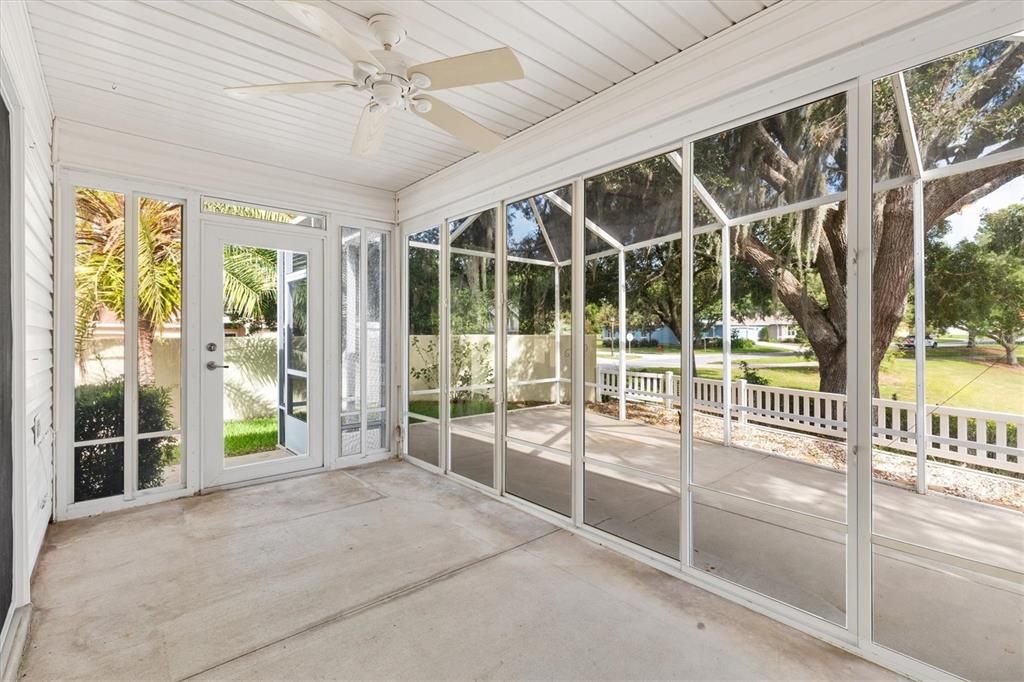 BIRDCAGE SHOWINIG DOOR TO SIDE YARD AND ENCLOSED LANAI