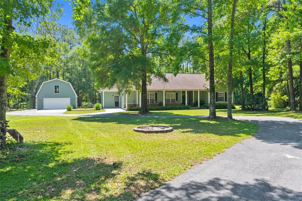 Nestled in the beauTiful trees on 11 acres!