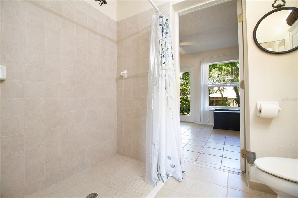 Primary bathroom with accessible entry shower.