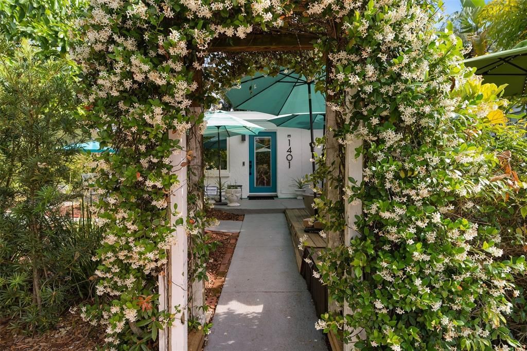 Jasmine covered archway entrance welcoming your guests