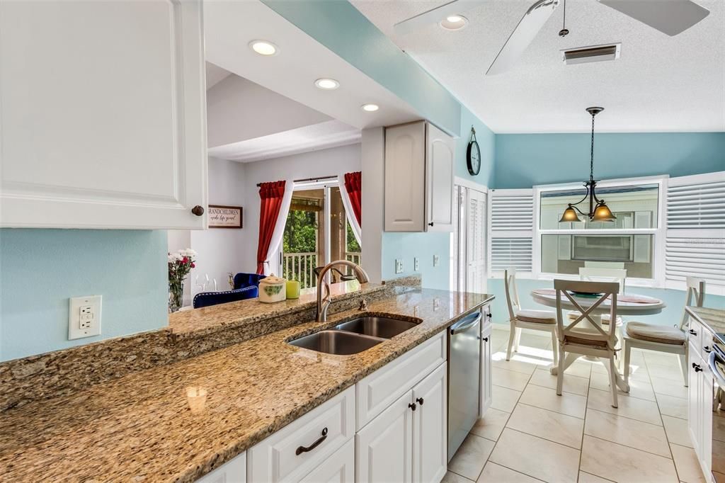 Beautifully updated kitchen featuring granite and new stainless appliances.