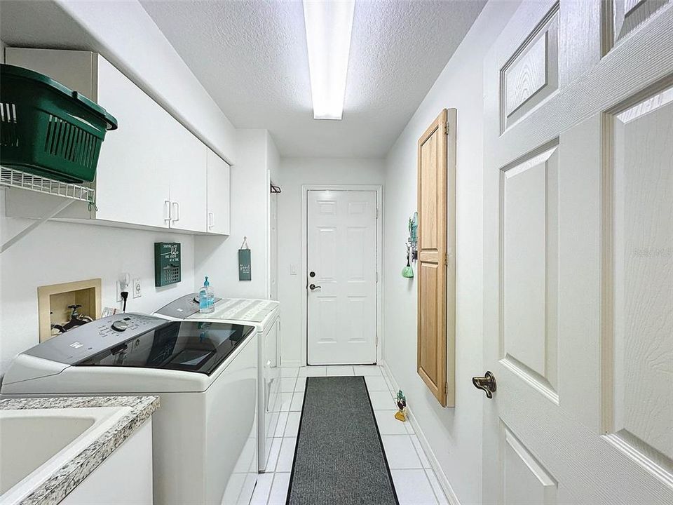 Inside Utility Room with built in ironing board