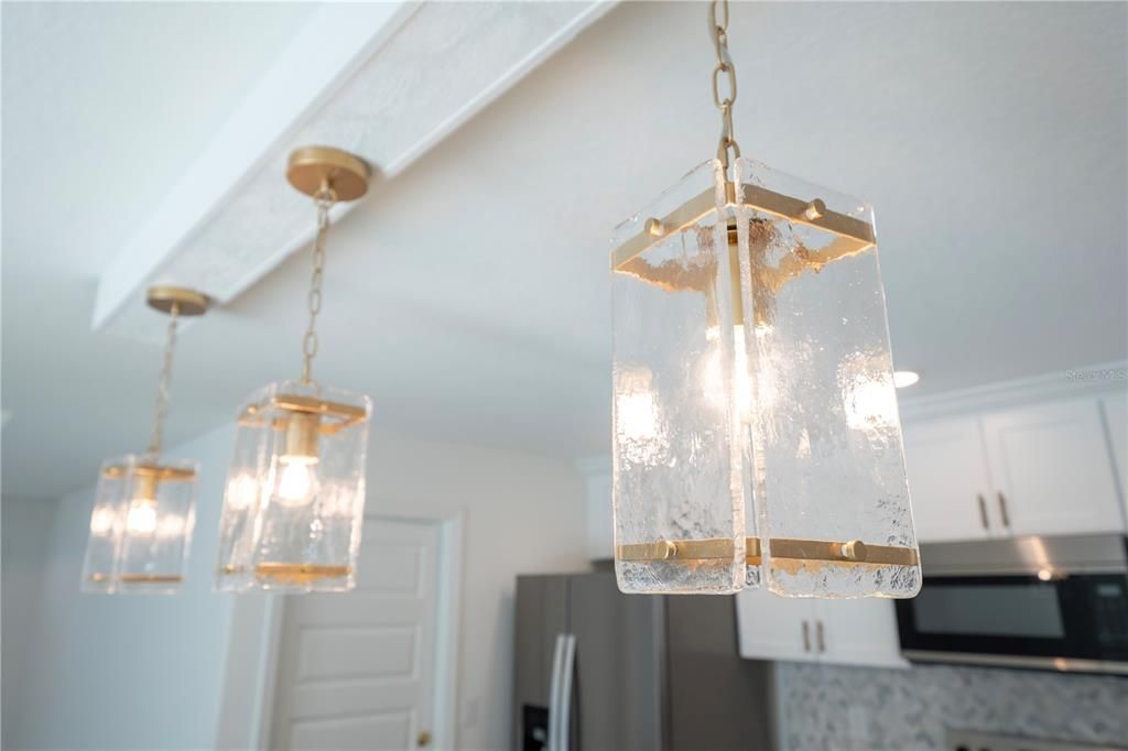Love these light fixtures.  Gold finishes matches the plumbing fixtures and backsplash