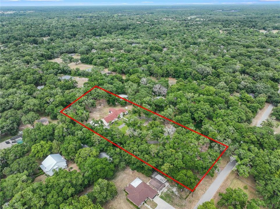 Arial view of 3 acre lot and custom home