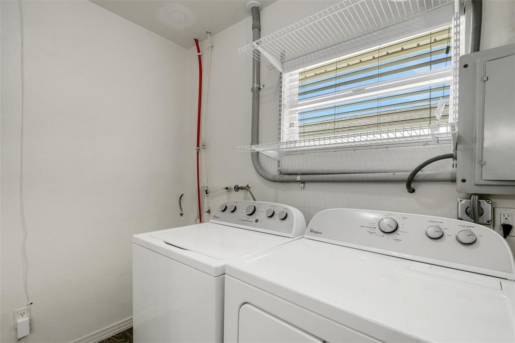 The laundry room , this home has tankless hot water as well.