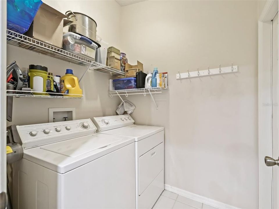 Separate  Laundry room with shelves