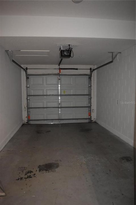 Attached one-car garage with driveway for convenient parking.