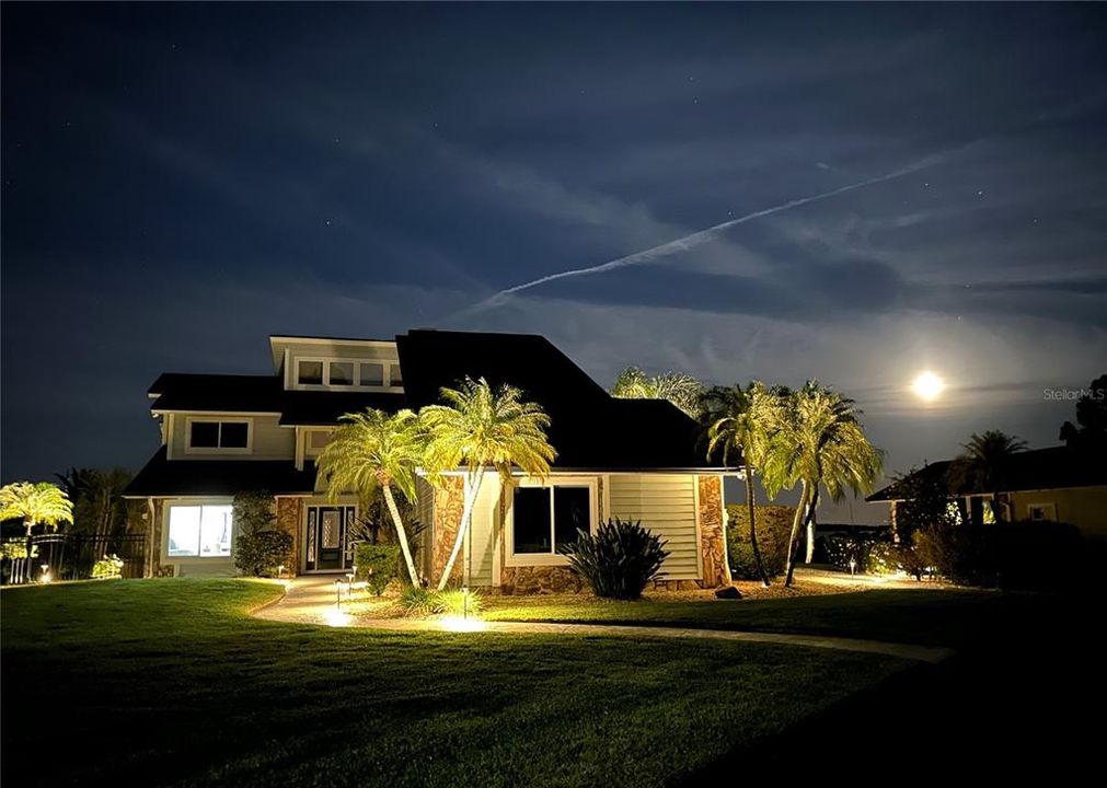 The lawn and pathways come alive at night with the landscape lighting.