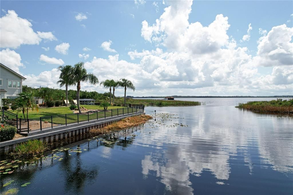 Full view of the boat ramp, boat dock and carport area.