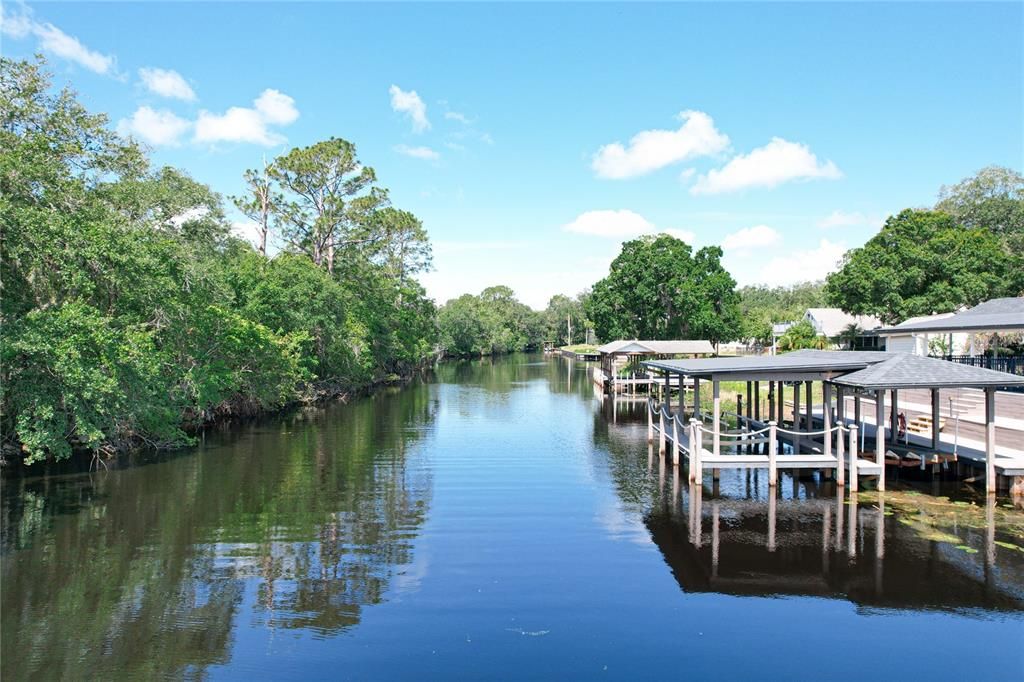 Dock with three slips, 2 jet ski lifts, boat lift and covered slip for a pontoon boat.