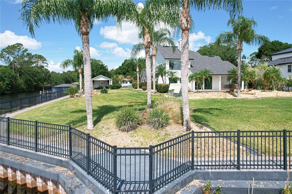 The entire property is fully fenced with 675 feet of wrought iron fencing.