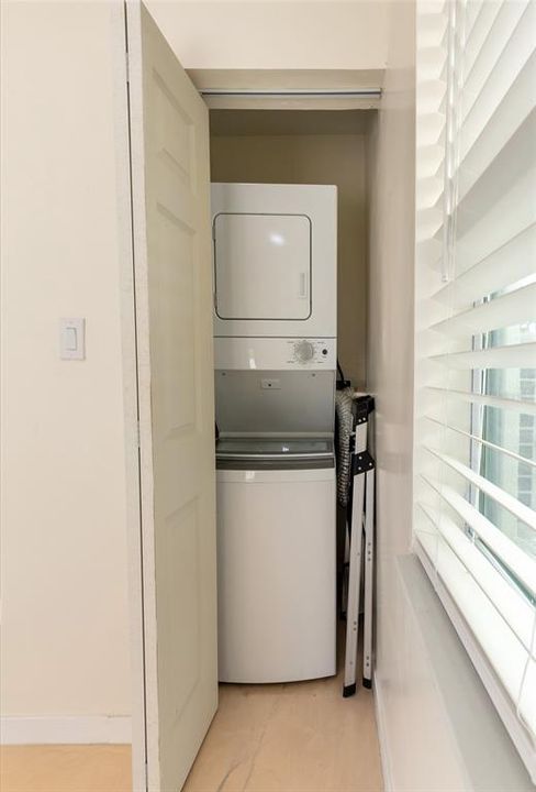 Unit A laundry closet with washer and dryer