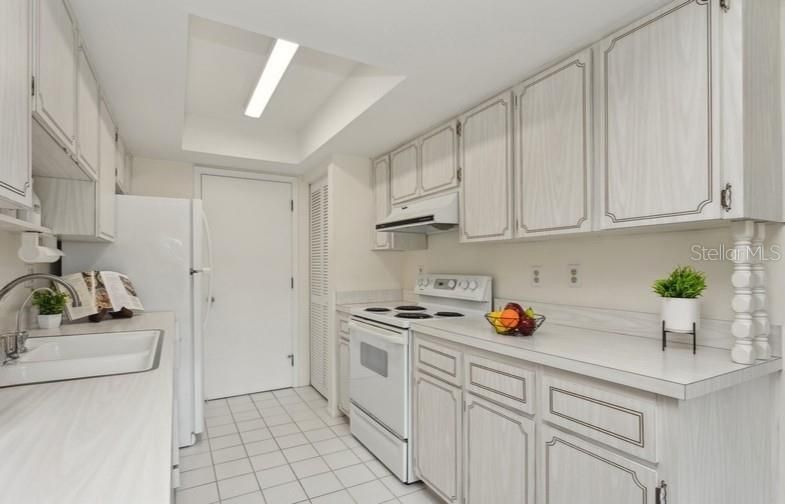 Efficient kitchen with nicely sized pantry closet~