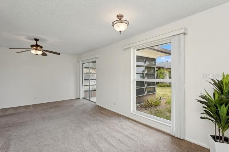 Newer carpet and beautiful floor to ceiling impact windows~