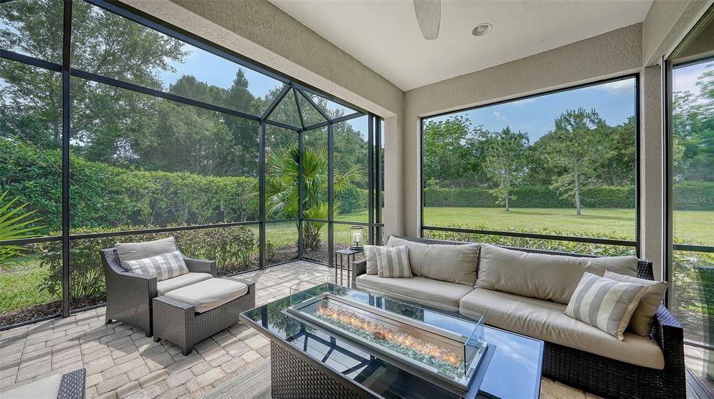 Extended lanai with beautiful view of green space.