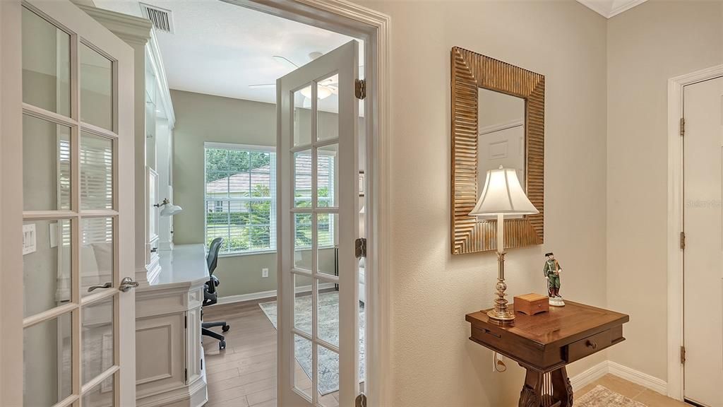 Foyer entry, French doors to the den.