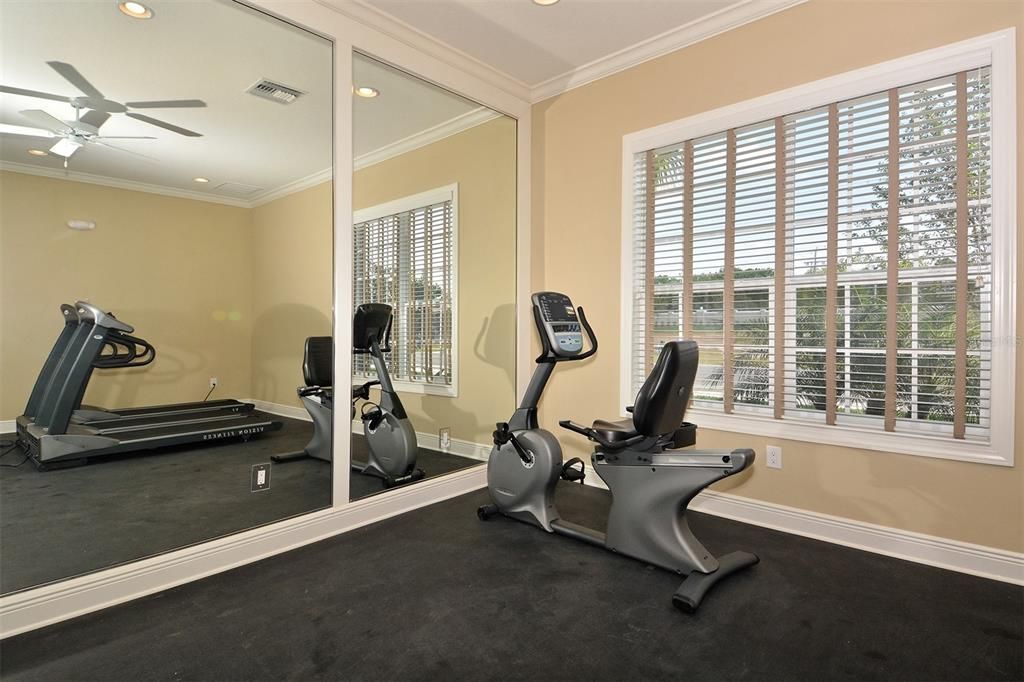 Fitness room with several types of equipment.