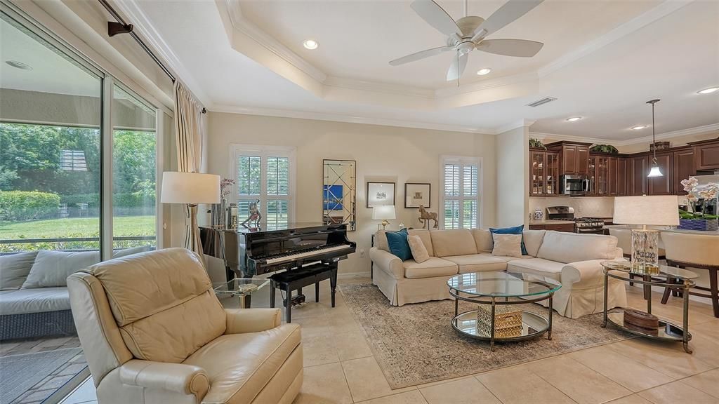 Coffered ceiling, crown molding, tile floors.