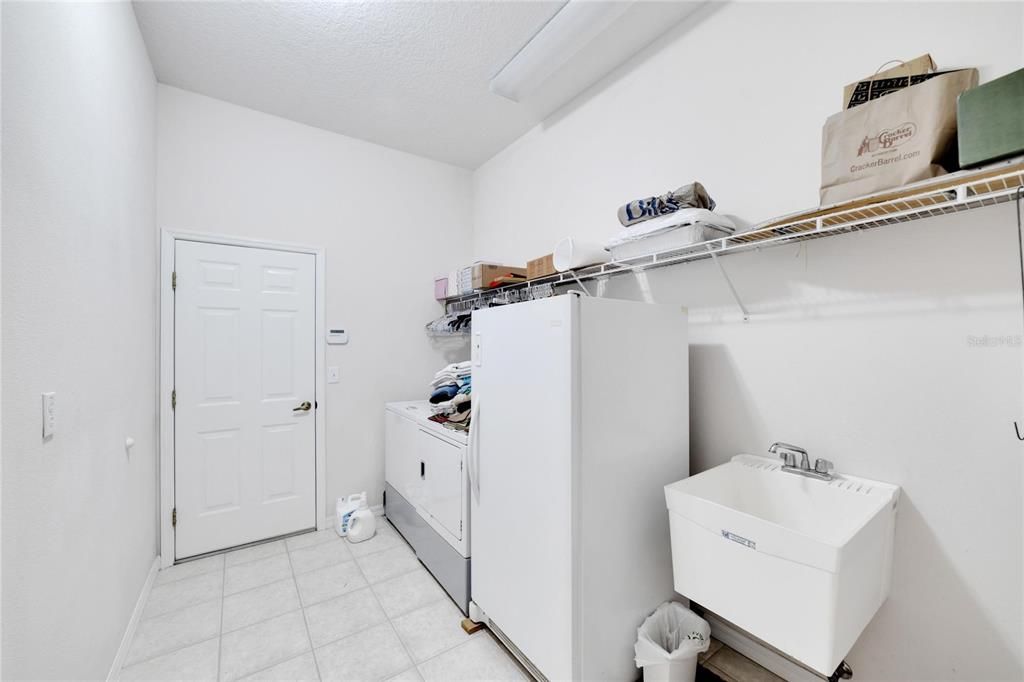 Laundry Room has a utility sink.  Washer/dryer and full size freezer are included.