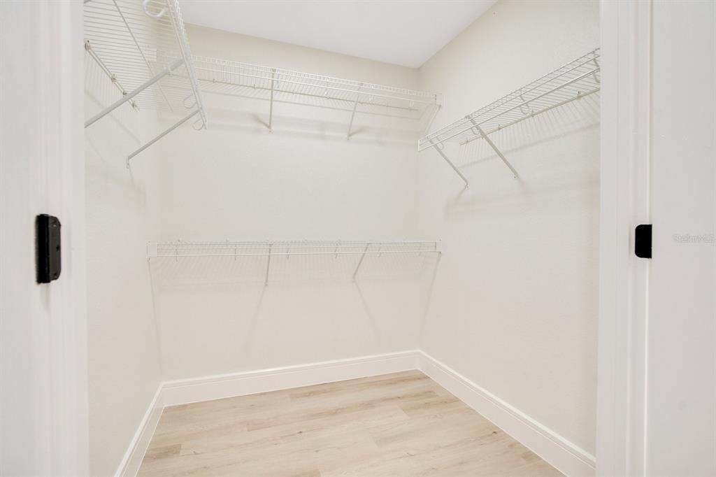 His and Hers Walk-in Closets (2)