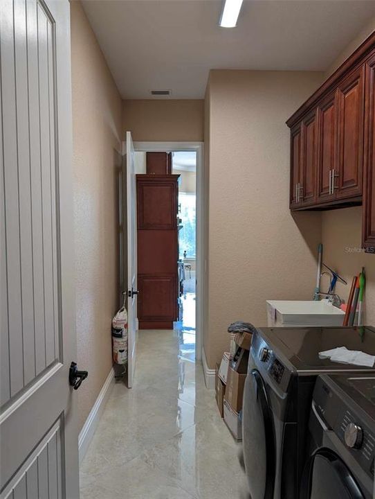 Entryway from four car garage into laundry room.