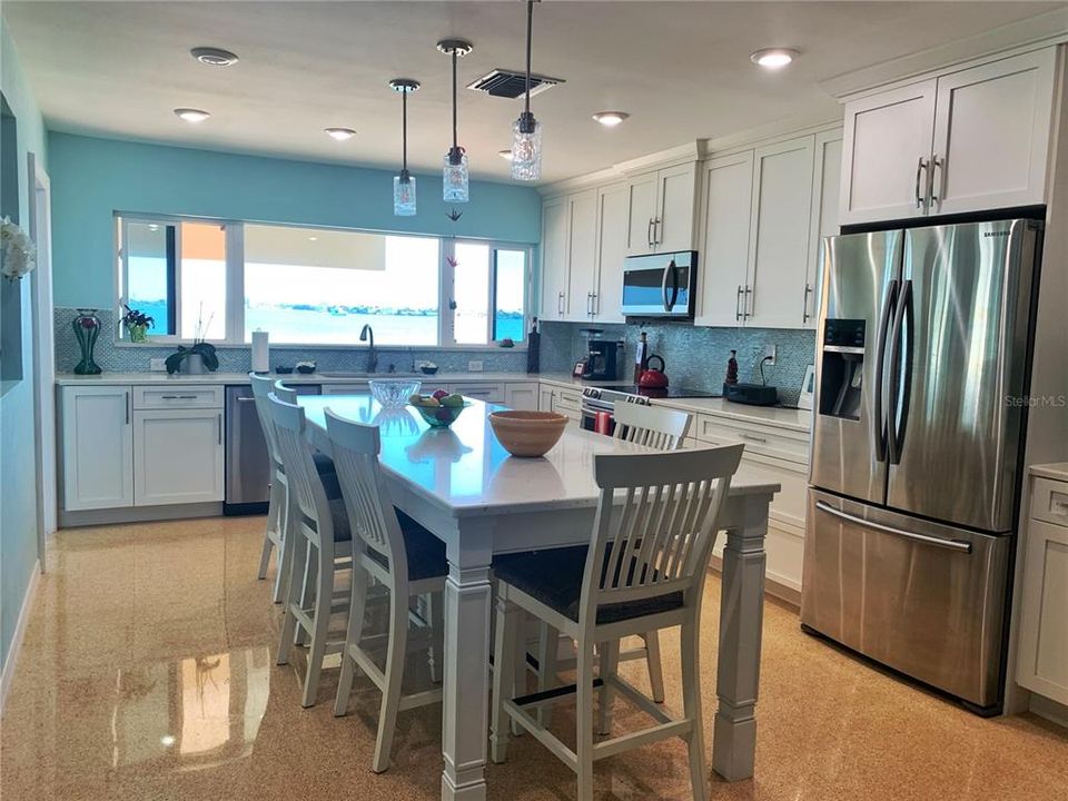 Fully Equipped Kitchen offers large island for entertaining and meals