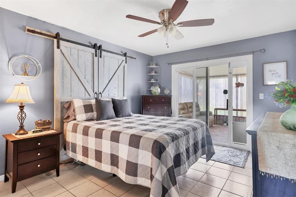 Primary bedroom with its own bathroom and patio