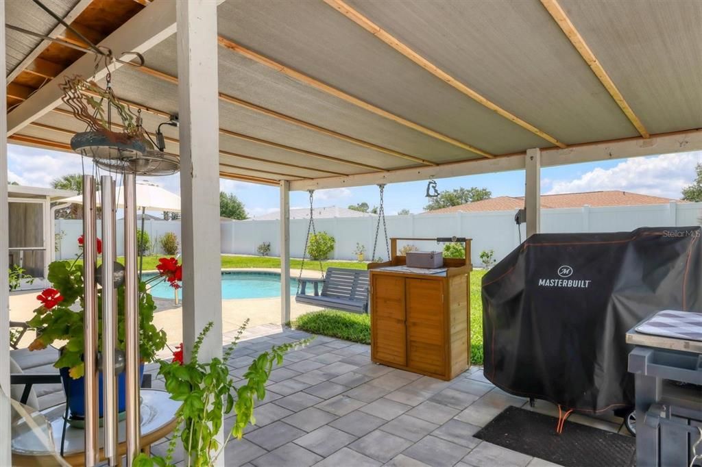 Covered open air patio along the pool